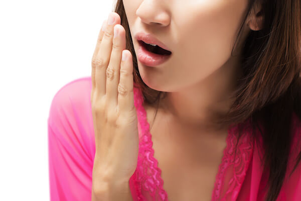 Yawning tired woman isolate on white background