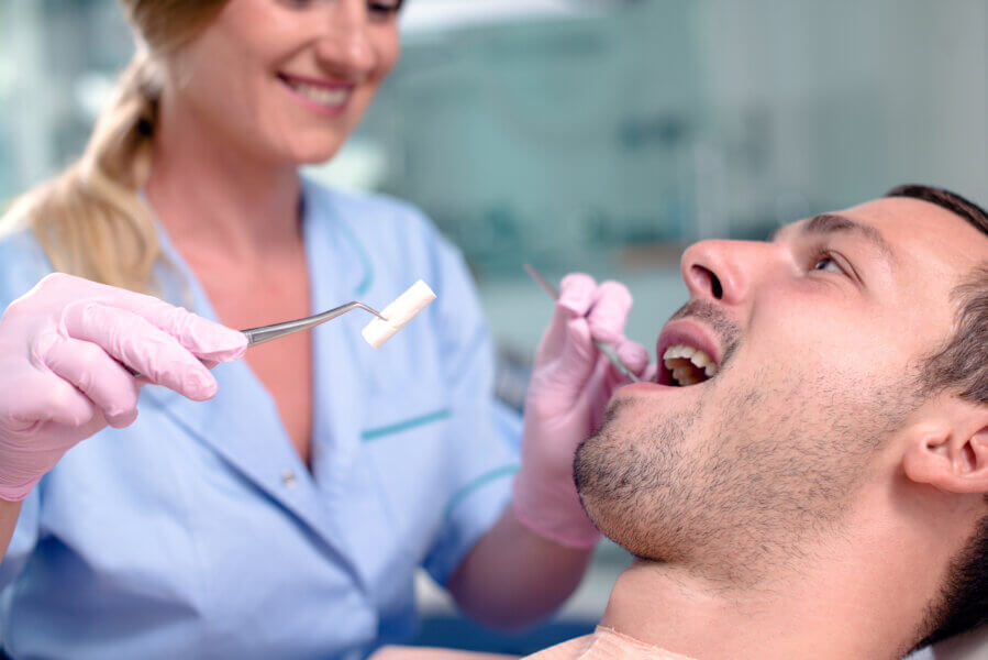 Happy patient at the dentist.