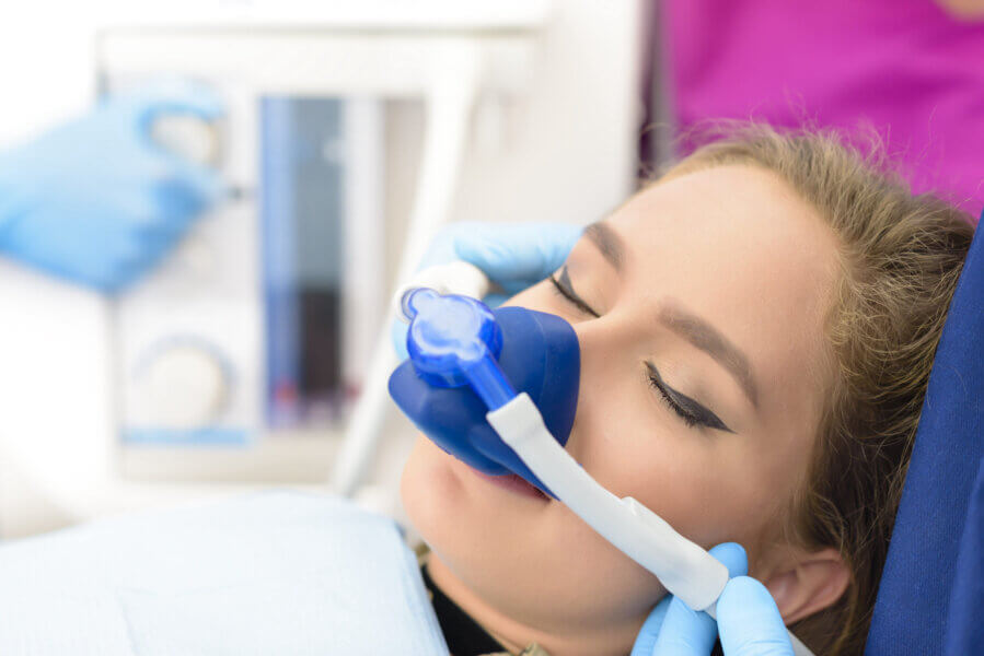 Dental Sedation Beautiful getting woman inhalation sedation at dental clinic