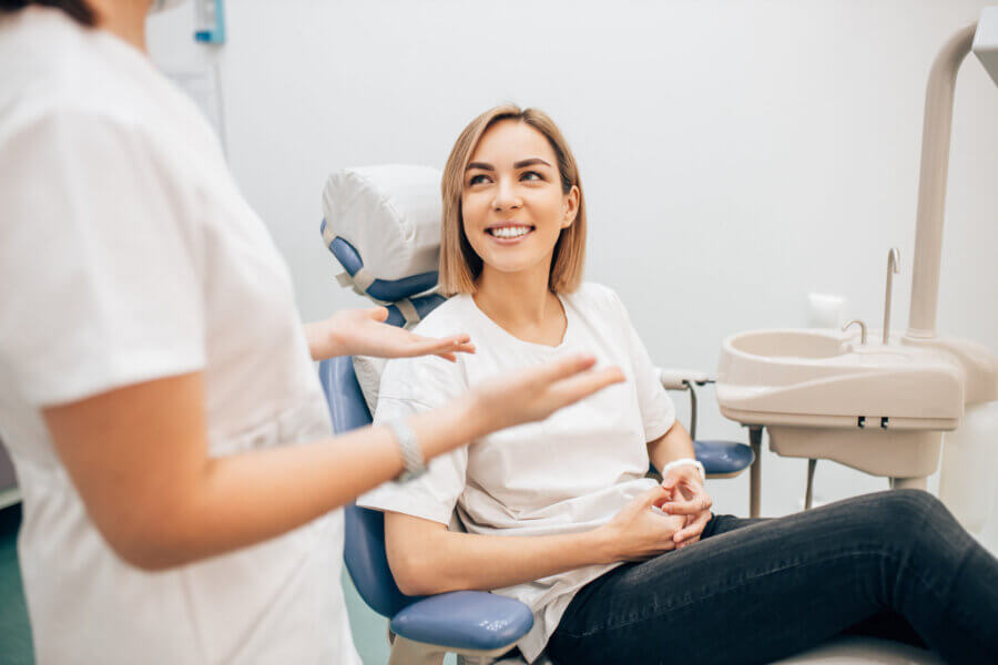 3D cone beam young beautiful lady with blond short hair sit in dentist office, waiting for a teeth treatment. Medicine, dentist concept